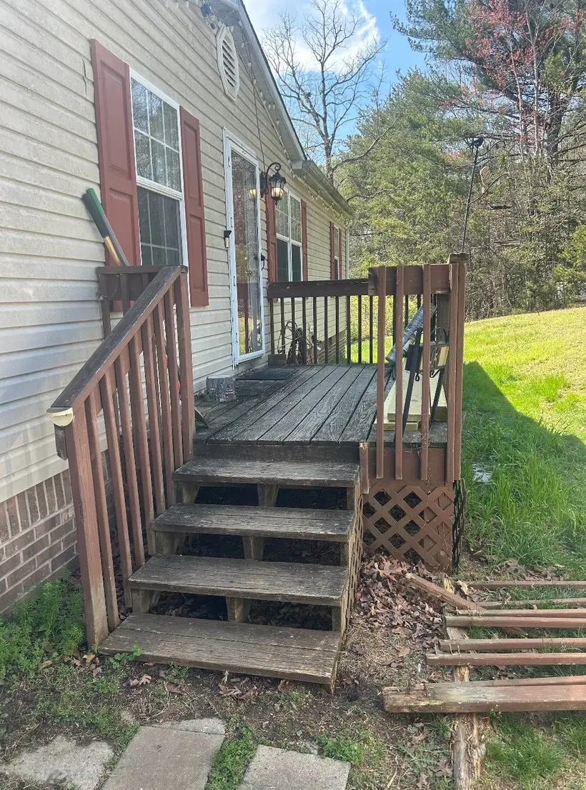 Small weathered front stoop and deck before covered porch build in Taylorsville NC — The Foothills Deck Company