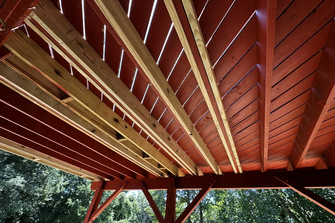 Underside of covered deck showing timber roof framing and beams NC Foothills — The Foothills Deck Company