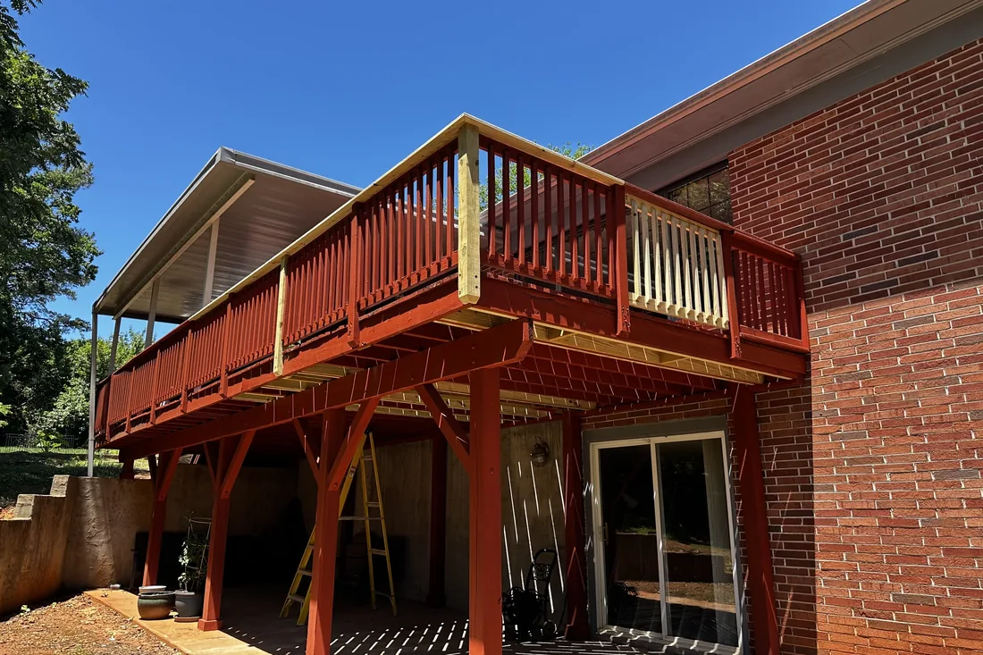 Elevated covered deck rebuild with new railings on a brick home NC Foothills — The Foothills Deck Company