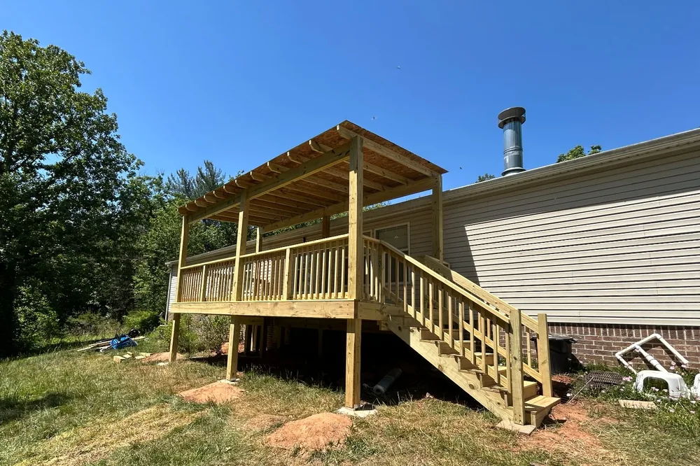 Elevated wood deck with pergola and staircase Hickory NC — The Foothills Deck Company