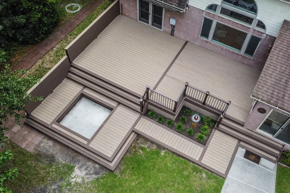Multi-level two-tone composite deck with fire pit and planters NC Foothills — The Foothills Deck Company